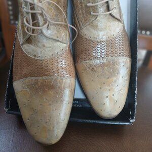 Novel spiffy mens lace ups in snakeskin and embossed leather.